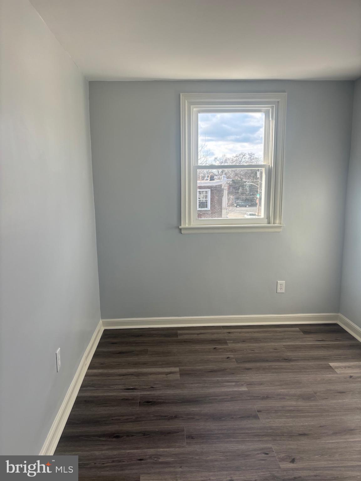 1870 Pratt Street Philadelphia, PA 19124 - Photo 8 of 23 a view of an empty room with wooden floor and a window