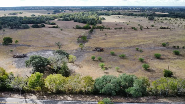 an aerial view of house with a yard