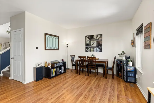 a view of staircase and living room with wooden floor