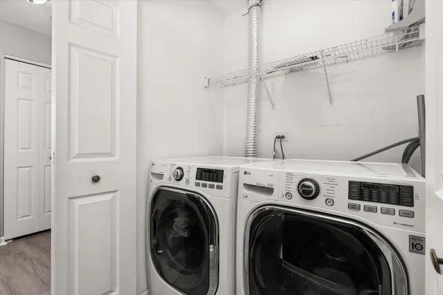 a bedroom with a bed and a television