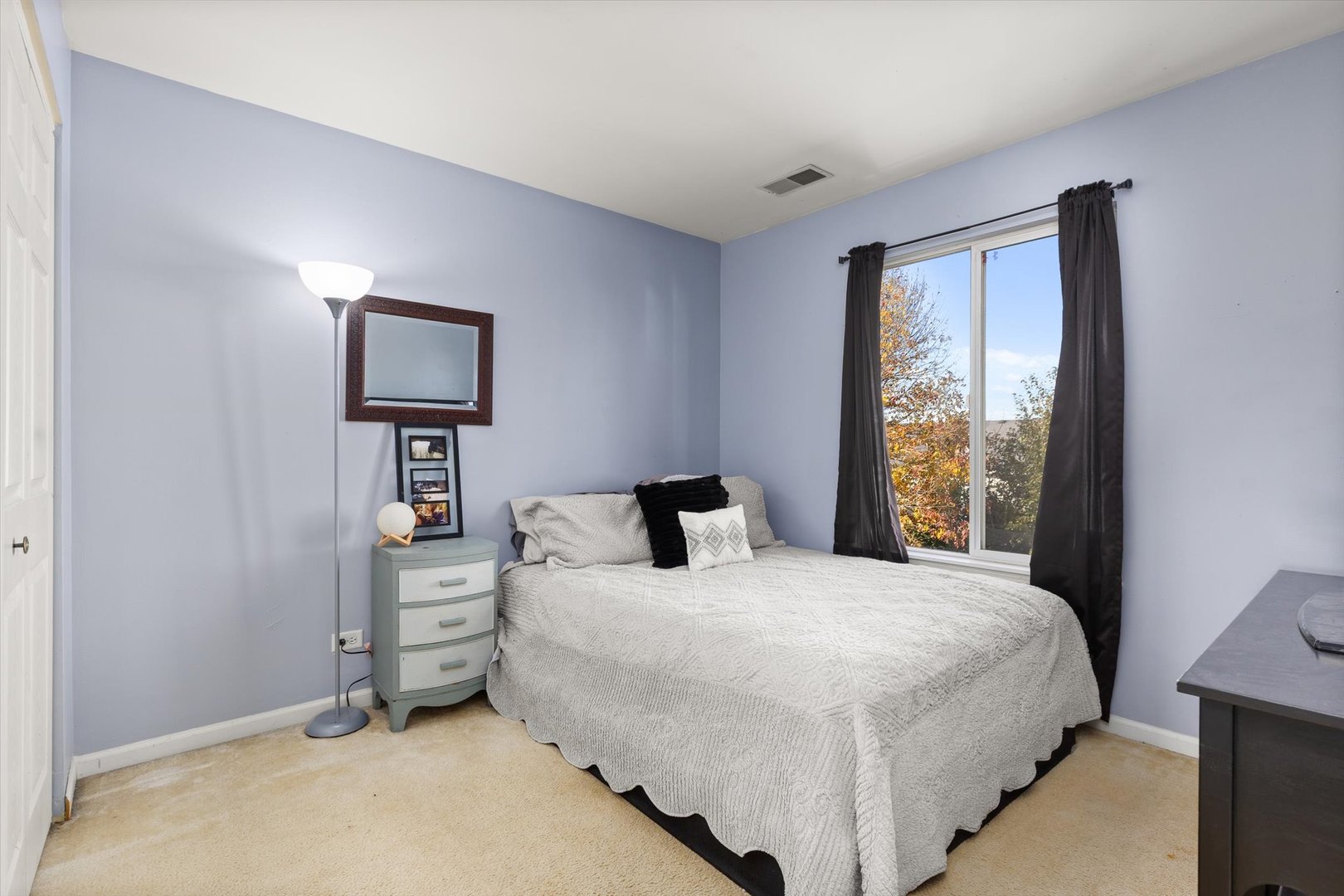2267 Margaret Drive Montgomery, IL 60538 - Photo 18 of 35 a bedroom with a bed and a tv