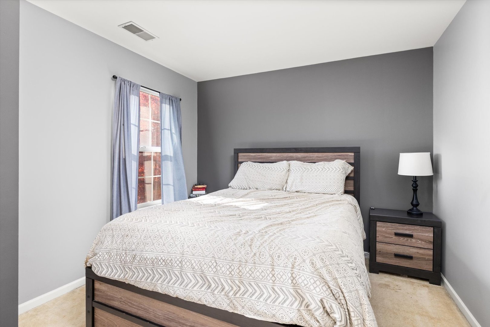 2267 Margaret Drive Montgomery, IL 60538 - Photo 20 of 35 a large bed sitting in a bedroom next to a window