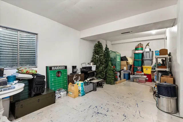 a kitchen with a refrigerator and a stove