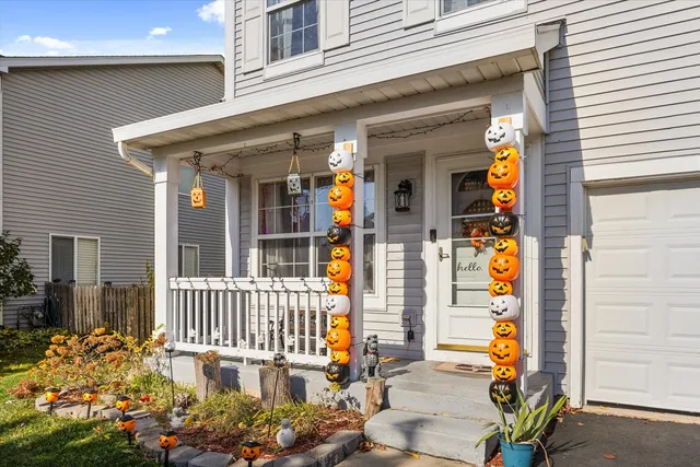 a living room with furniture a lamp and a window