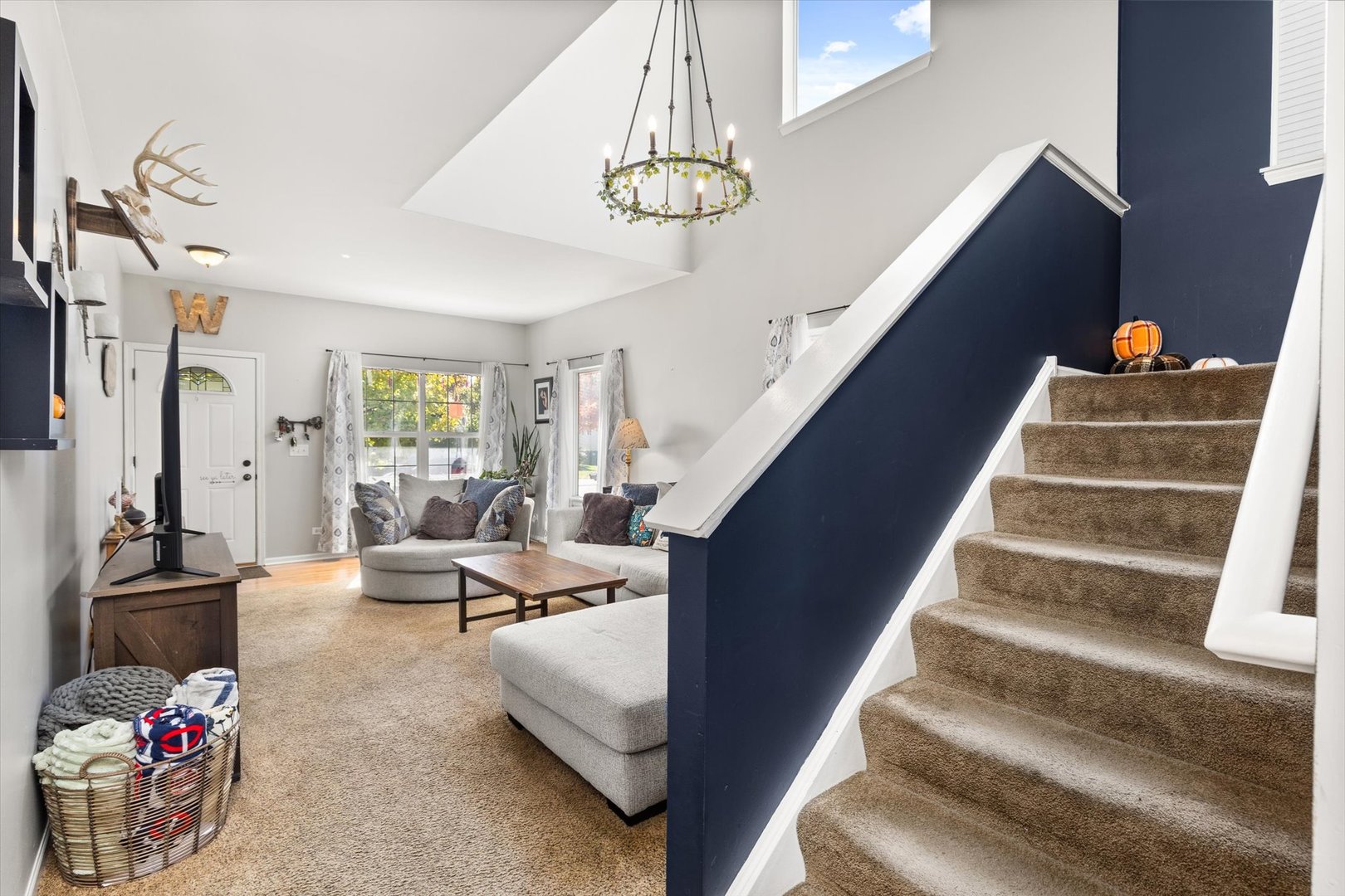 2267 Margaret Drive Montgomery, IL 60538 - Photo 7 of 35 a living room with furniture and a chandelier