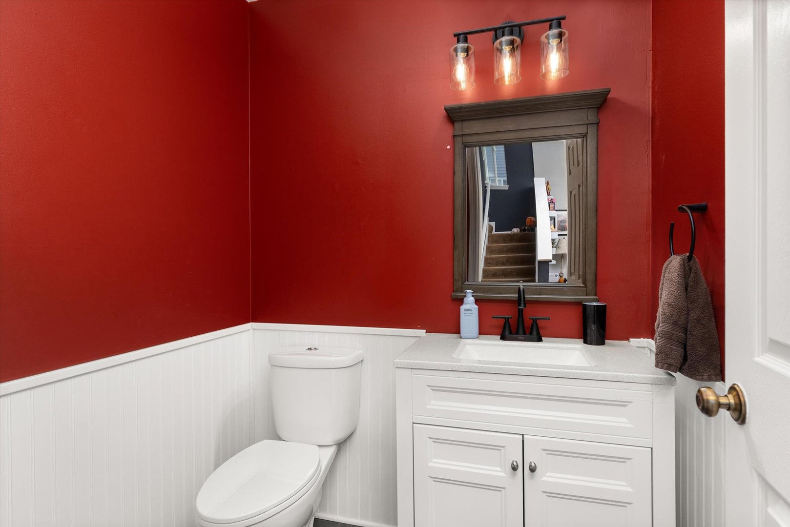 2267 Margaret Drive Montgomery, IL 60538 - Photo 8 of 35 a bathroom with a toilet sink and mirror