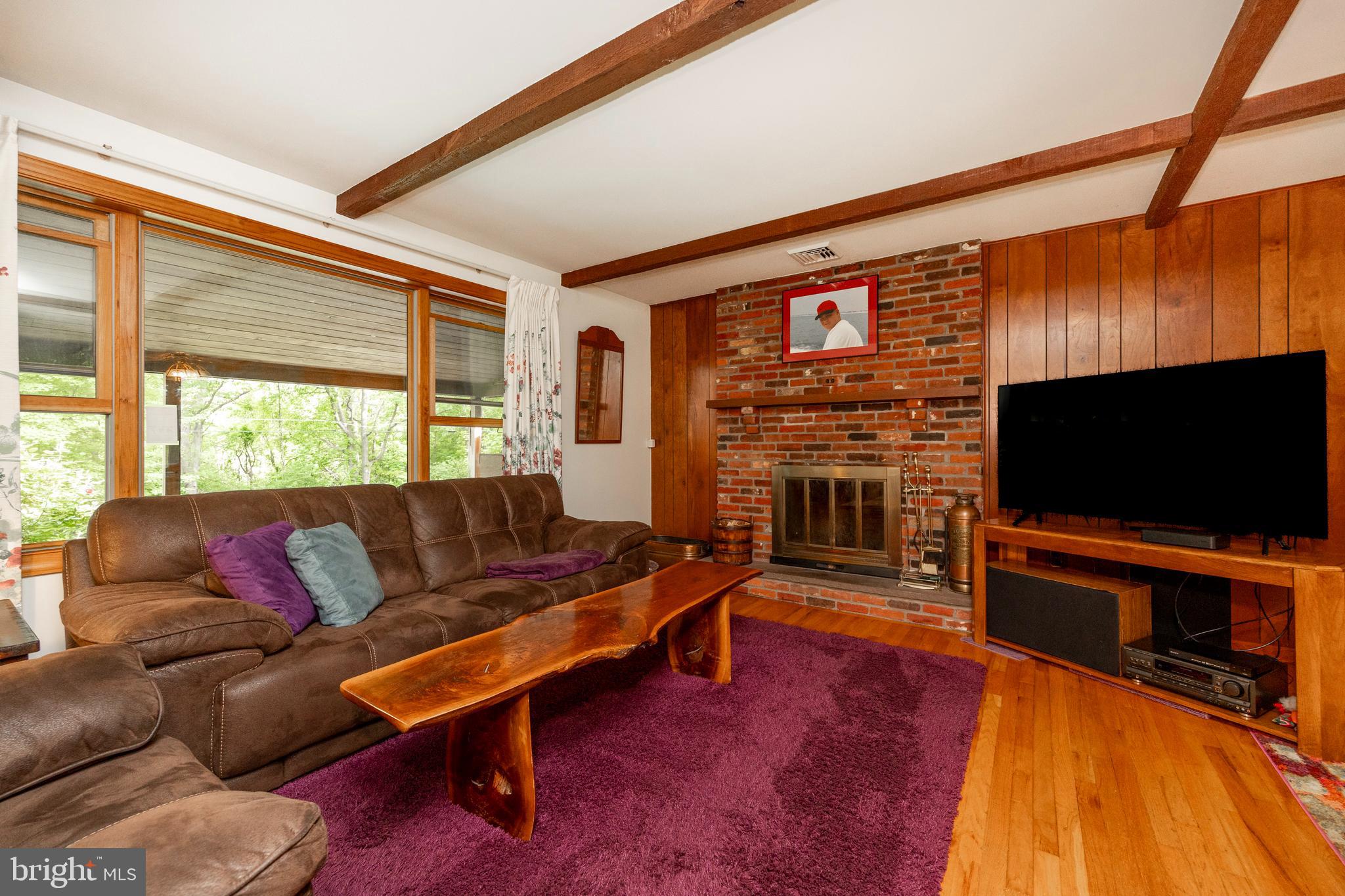 1196 Schoolhouse Road Pottstown, PA 19465 - Photo 31 of 61 Living room with brick fireplace