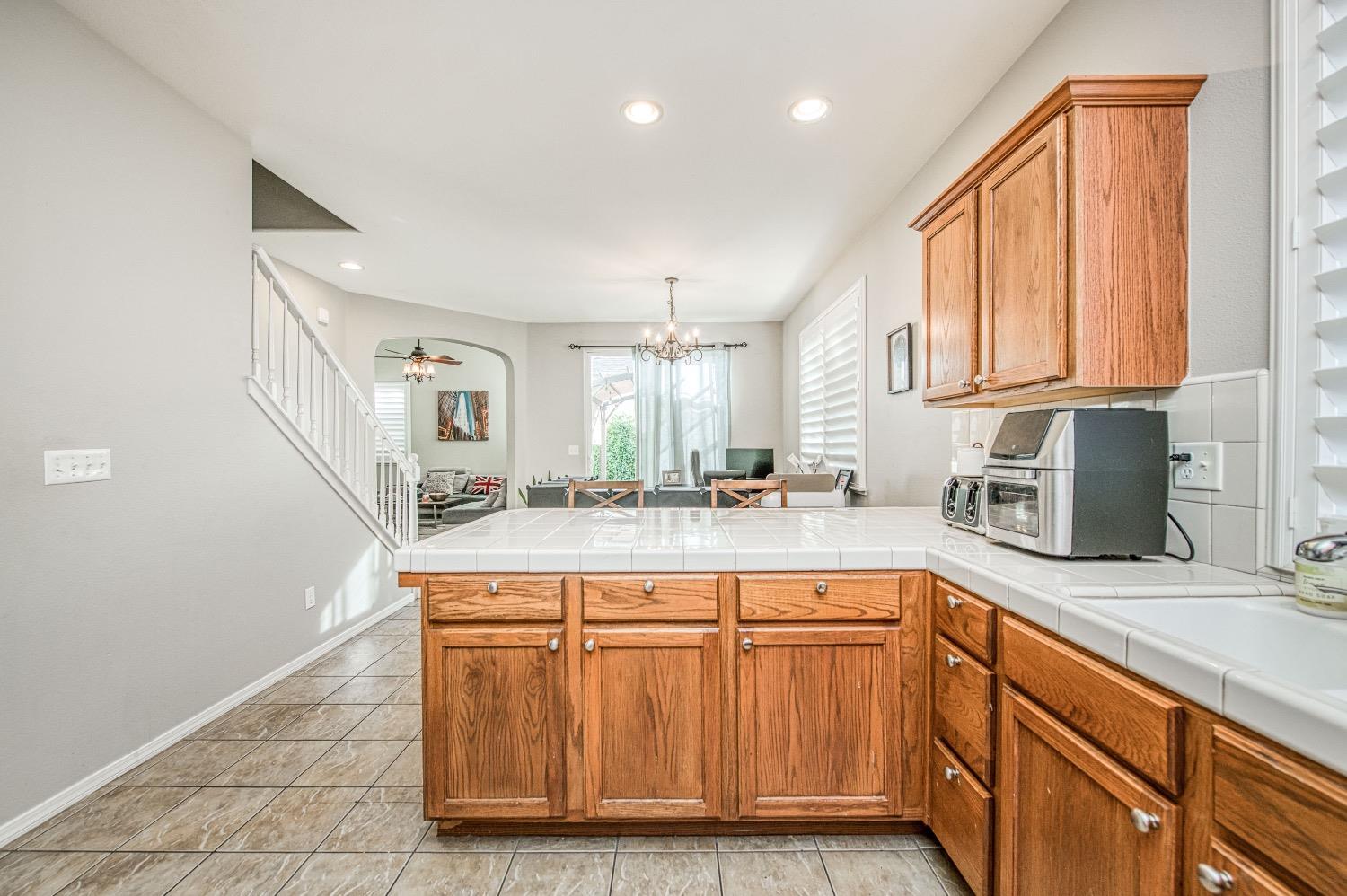 1648 North Avignon Lane Clovis, CA 93619 - Photo 13 of 27 a kitchen with stainless steel appliances granite countertop a sink and a stove