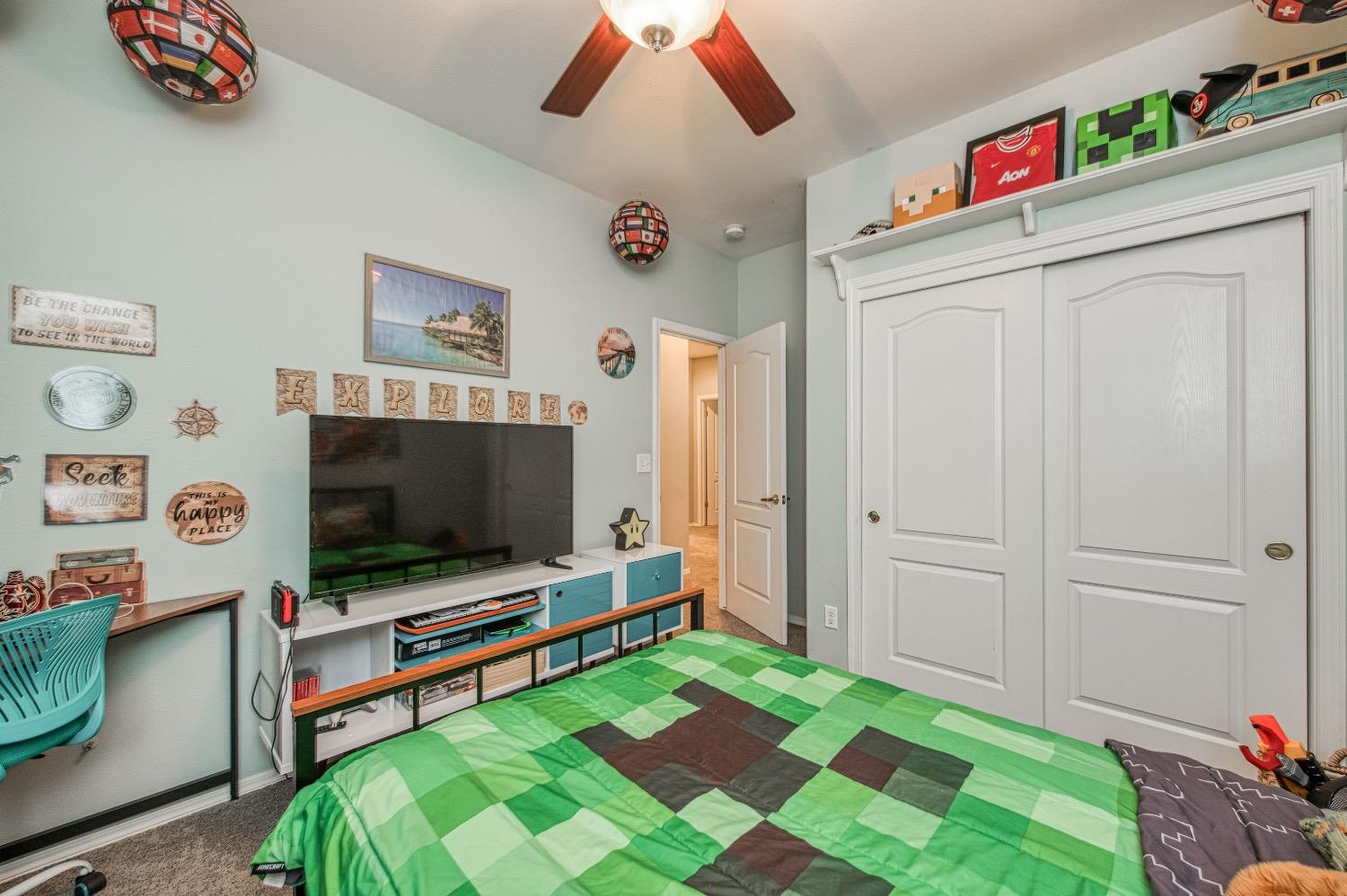 1648 North Avignon Lane Clovis, CA 93619 - Photo 15 of 27 a living room with furniture and a flat screen tv