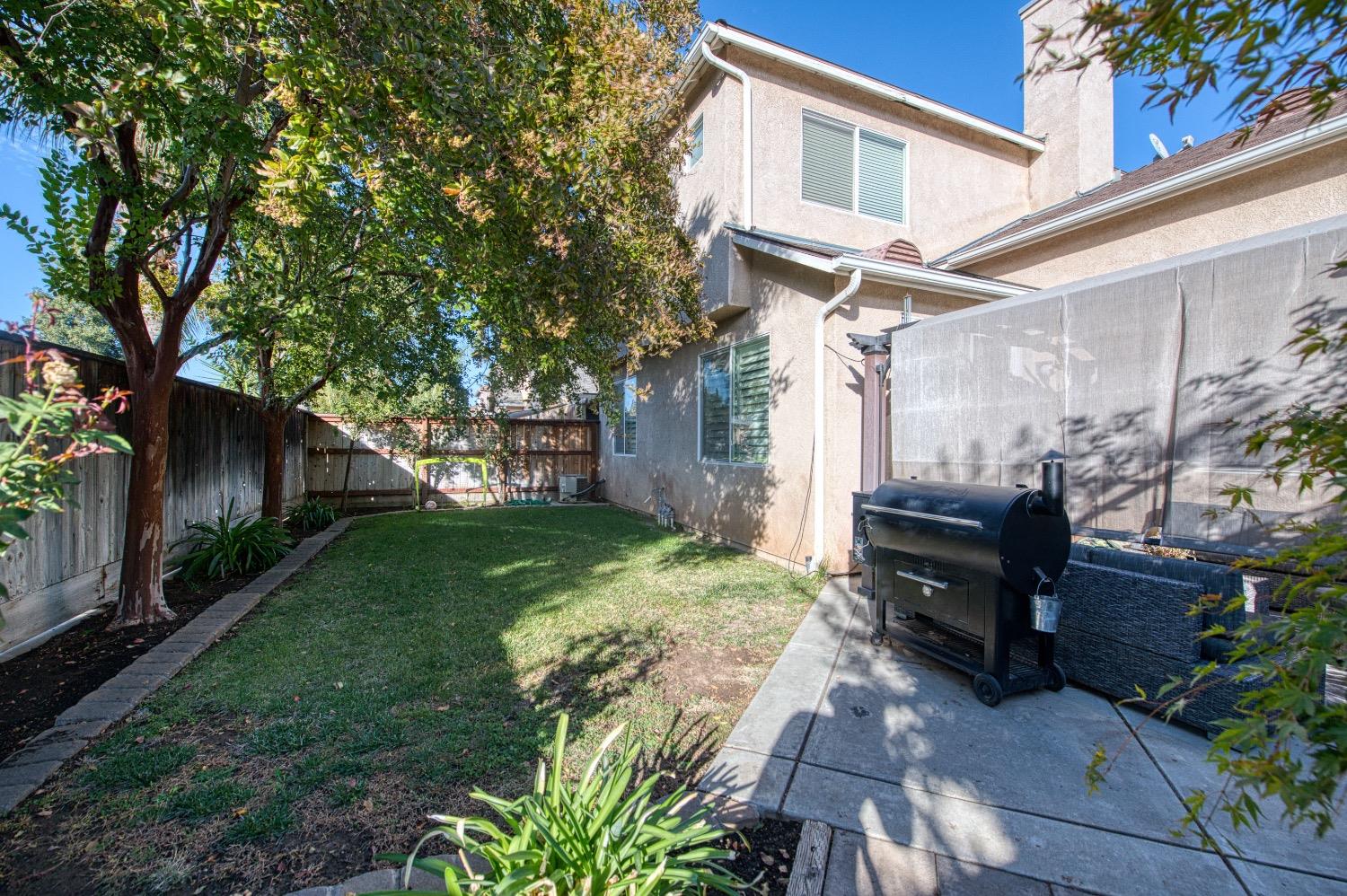 1648 North Avignon Lane Clovis, CA 93619 - Photo 27 of 27 a view of a house with backyard and sitting area