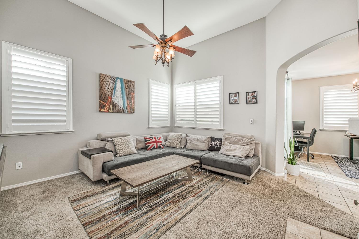 1648 North Avignon Lane Clovis, CA 93619 - Photo 4 of 27 a living room with furniture and a large window