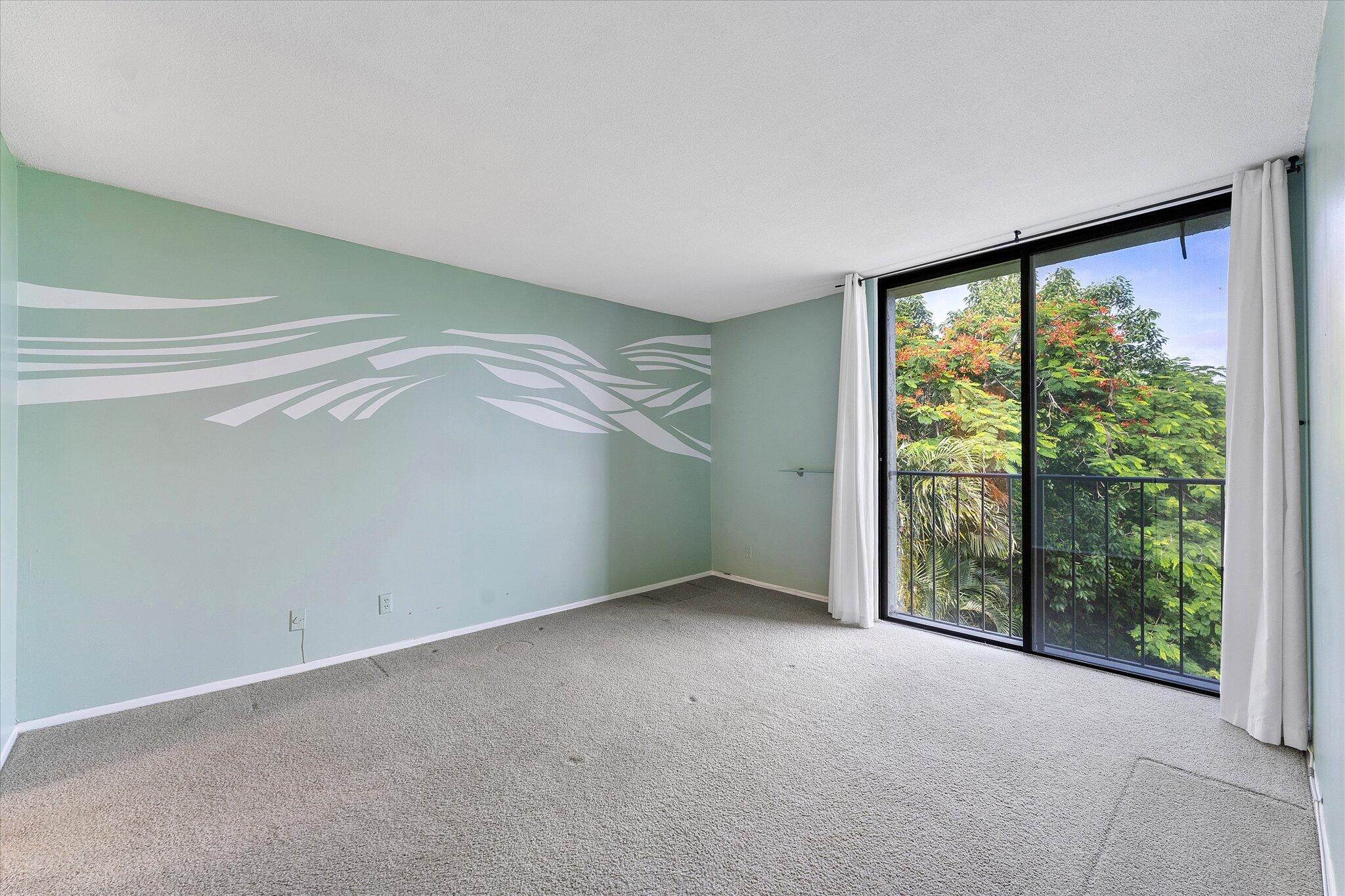 501 Southwest 11th Place, Unit 418 Boca Raton, FL 33432 - Photo 13 of 35 a view of an empty room with a window