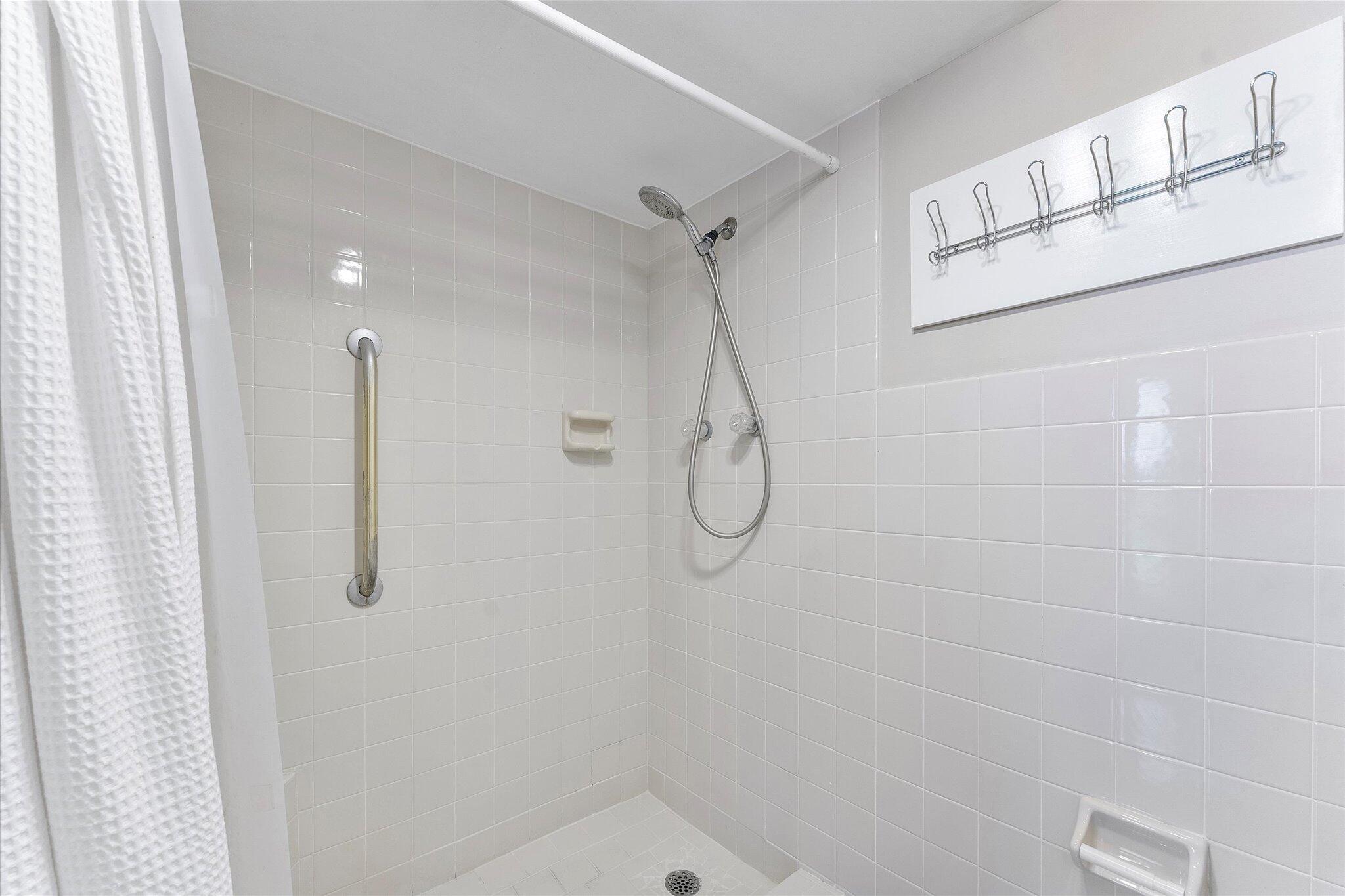 501 Southwest 11th Place, Unit 418 Boca Raton, FL 33432 - Photo 16 of 35 a bathroom with a shower