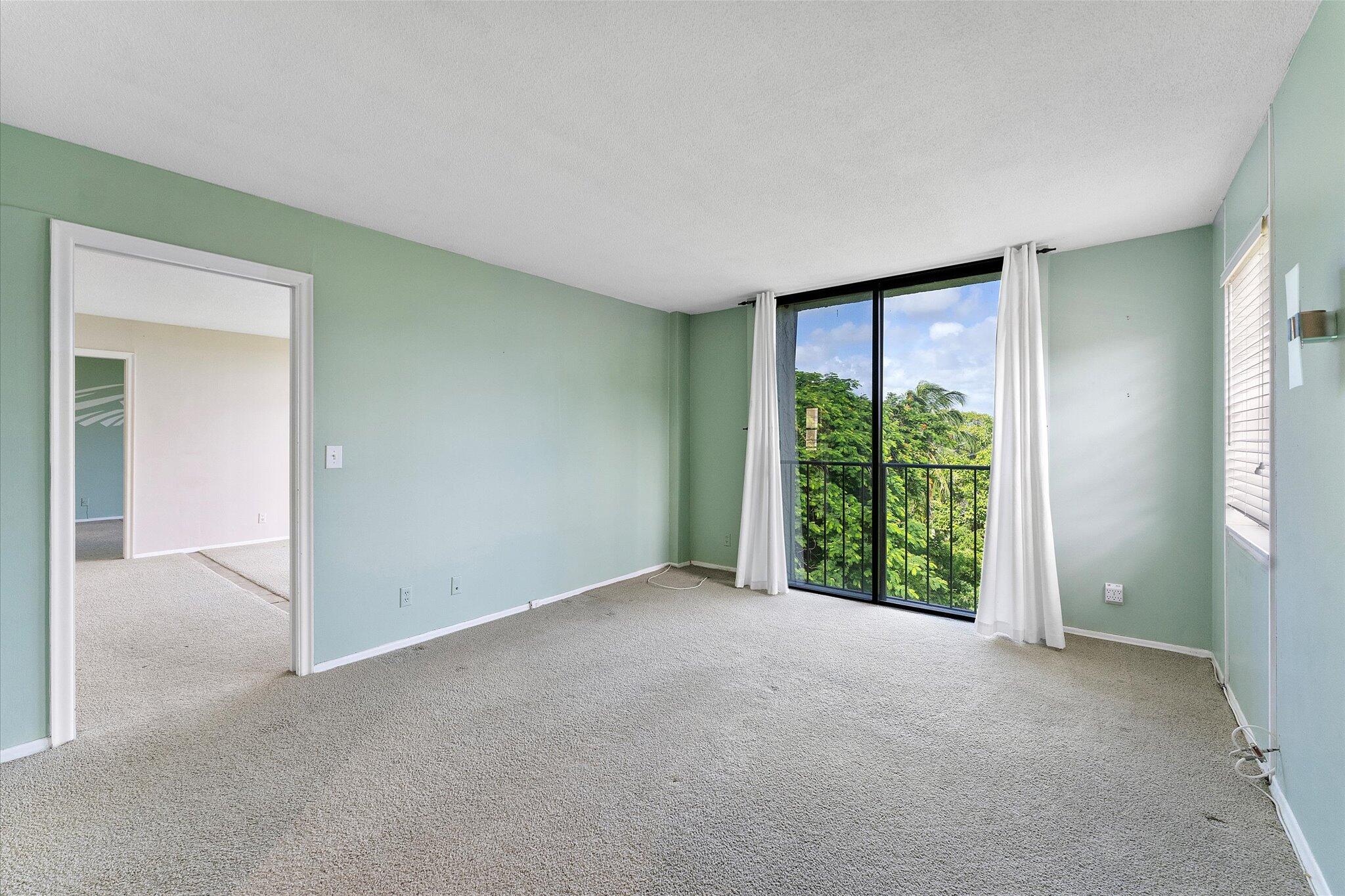 501 Southwest 11th Place, Unit 418 Boca Raton, FL 33432 - Photo 22 of 35 a view of an empty room with a window
