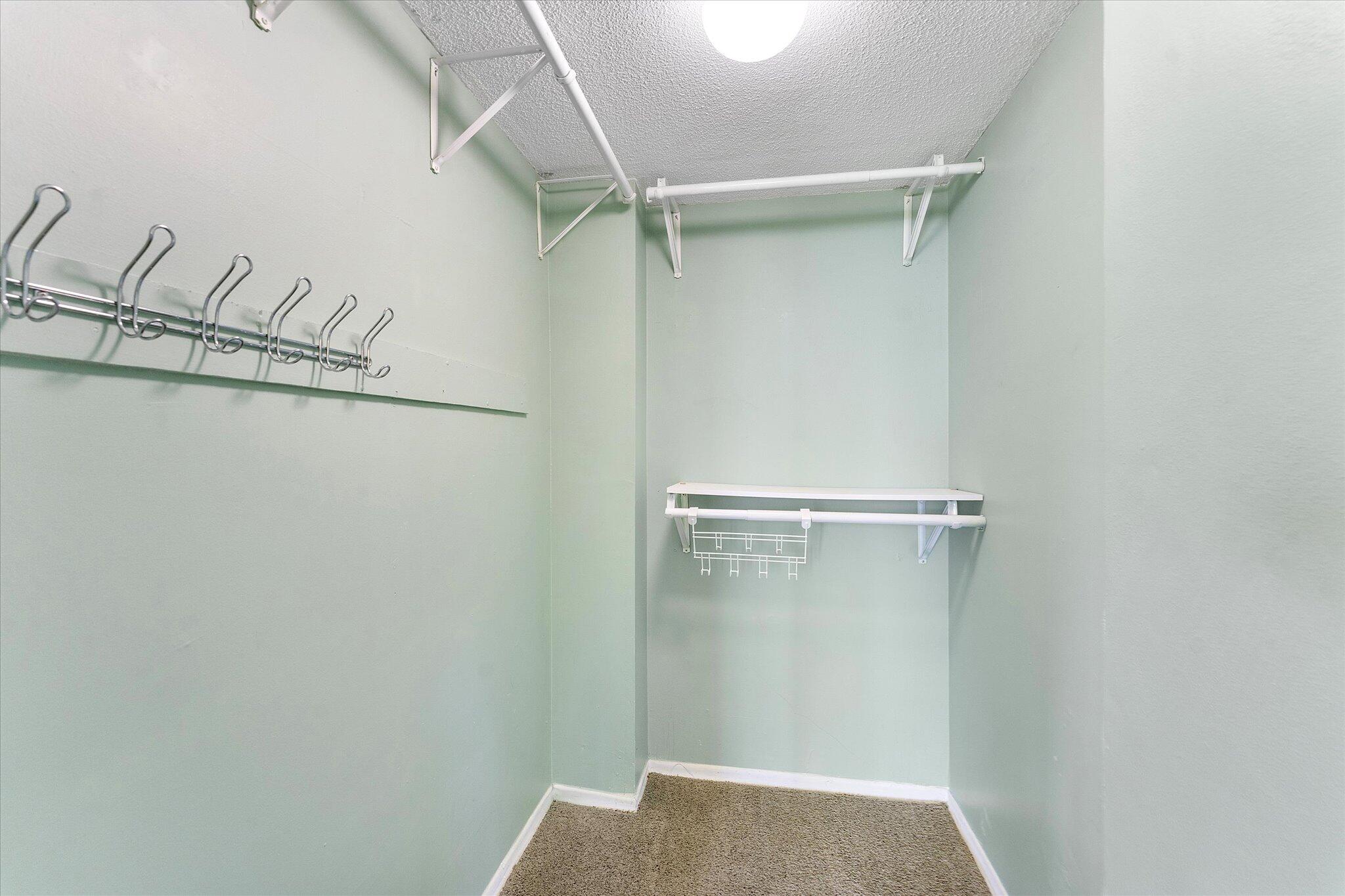 501 Southwest 11th Place, Unit 418 Boca Raton, FL 33432 - Photo 24 of 35 a view of walk in closet with empty racks