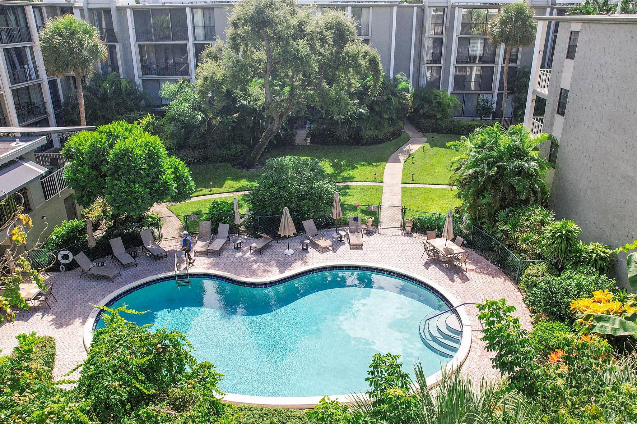 501 Southwest 11th Place, Unit 418 Boca Raton, FL 33432 - Photo 28 of 35 a view of a swimming pool with a patio