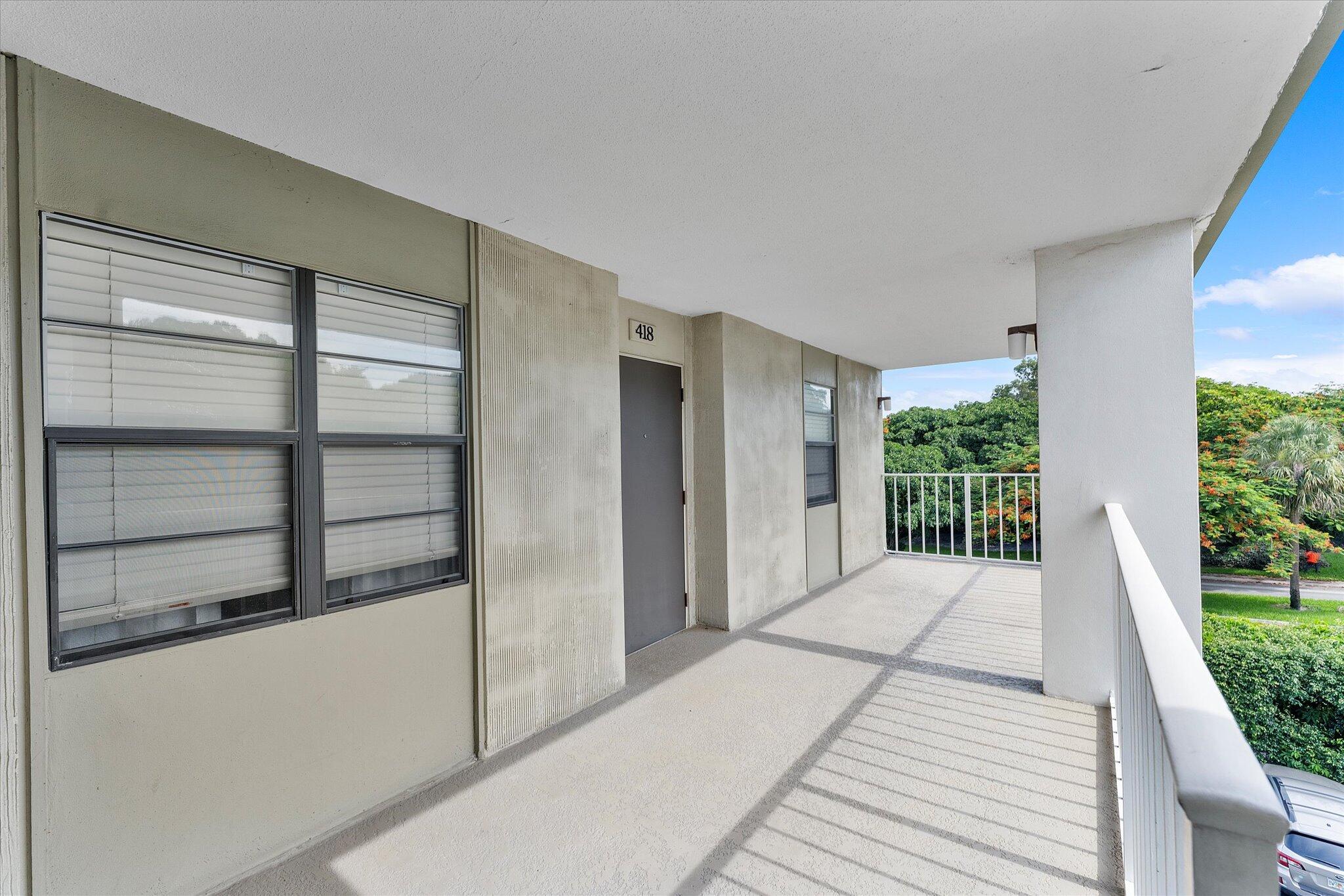 501 Southwest 11th Place, Unit 418 Boca Raton, FL 33432 - Photo 4 of 35 a balcony with view of wooden floor