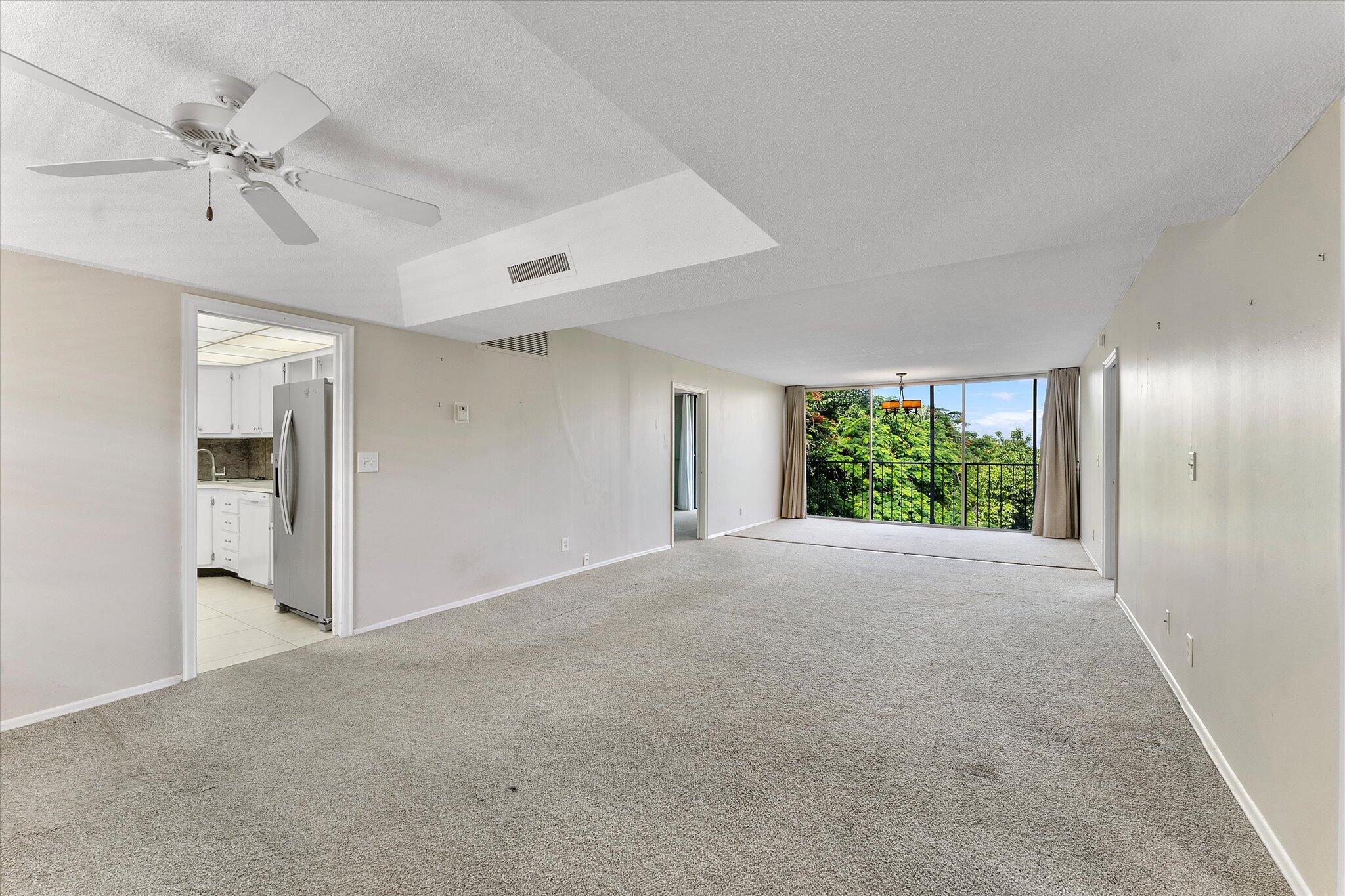501 Southwest 11th Place, Unit 418 Boca Raton, FL 33432 - Photo 6 of 35 a view of a room with a window and a ceiling fan