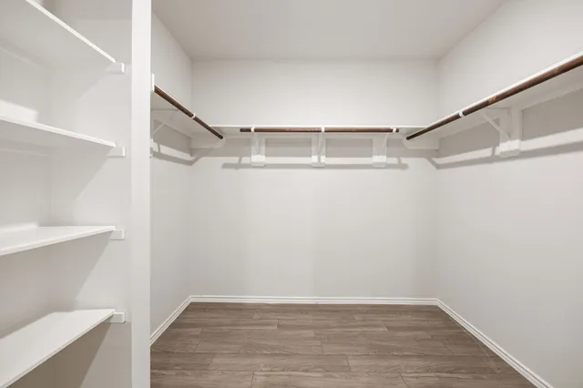 a view of an empty walk in closet