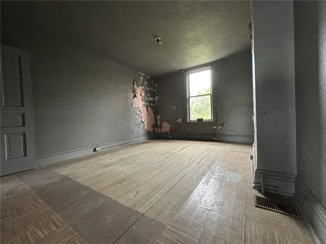 a view of an empty room and window