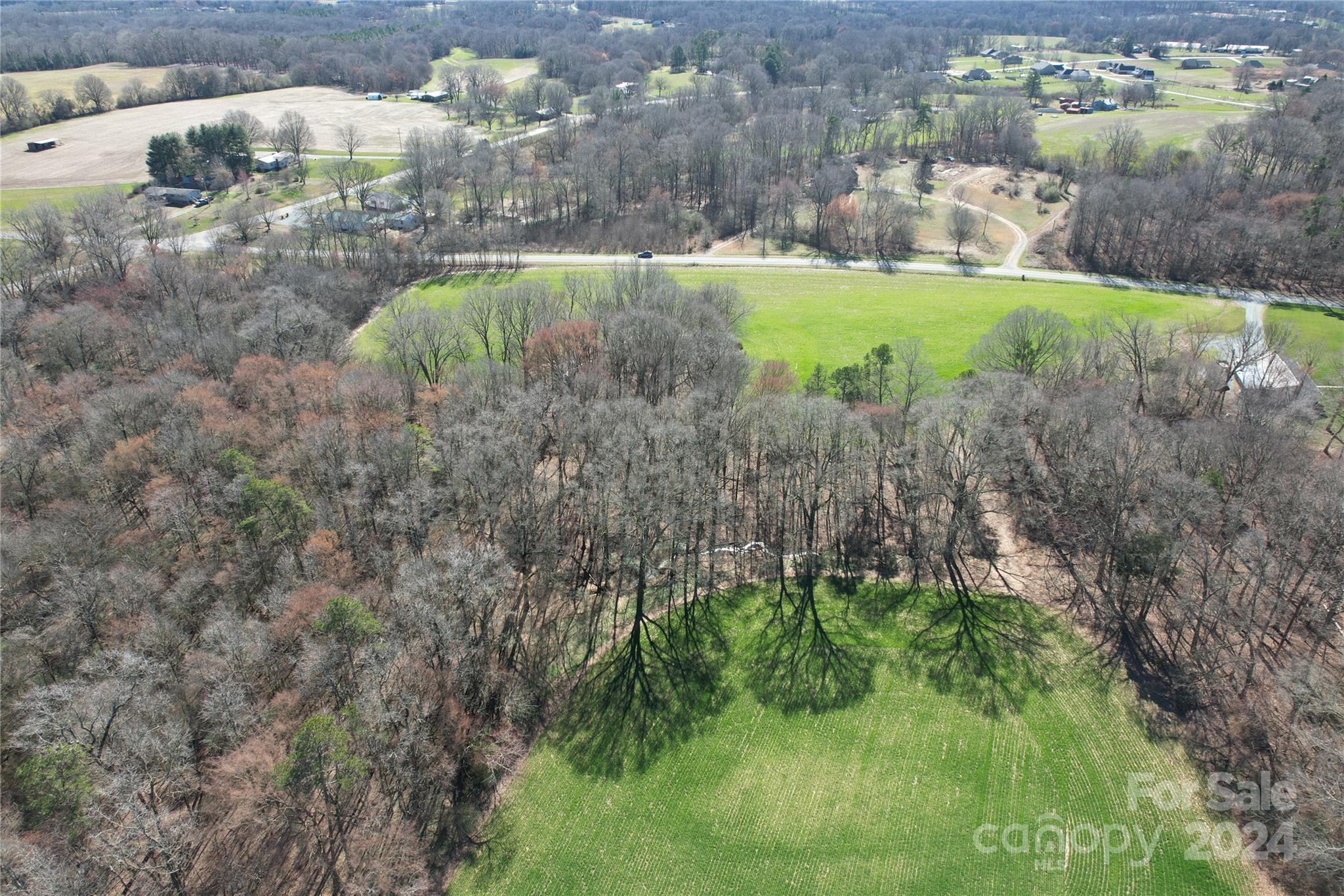0 Old Ferry Road Monroe, NC 28110 - Photo 13 of 14 a view of a garden with a building