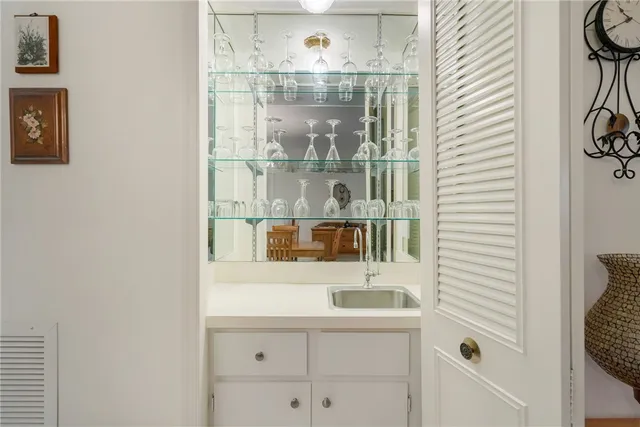 a bathroom with a sink and a window