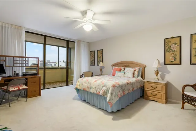 a bedroom with a bed chair and window