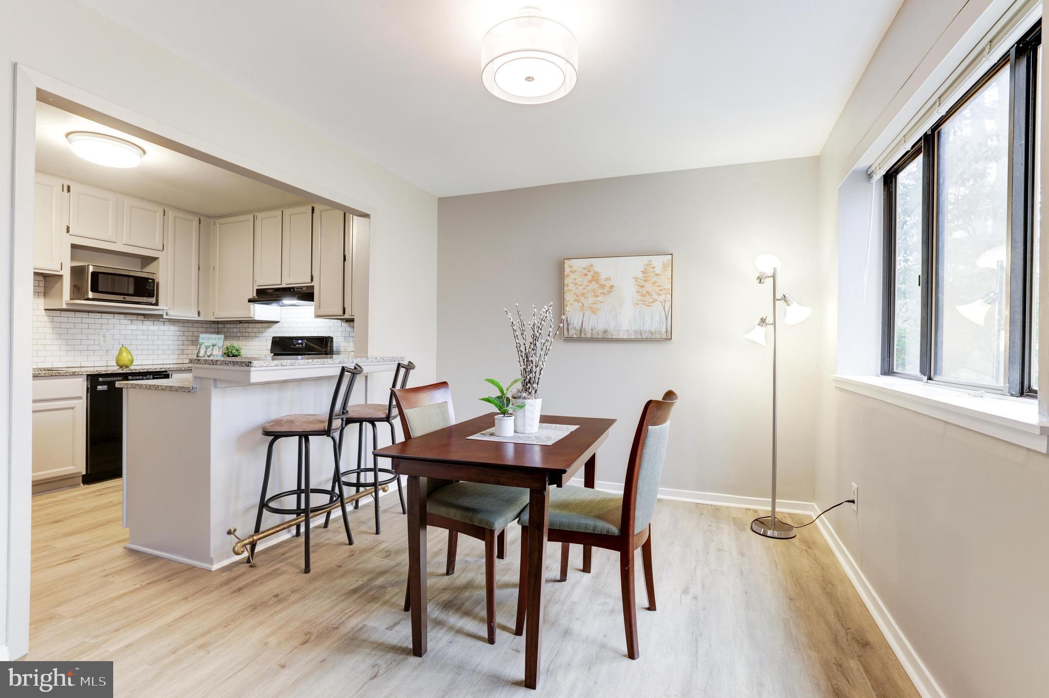 1668 Parkcrest Circle, Unit 100 Reston, VA 20190 - Photo 11 of 22 Breakfast bar with large granite countertop.