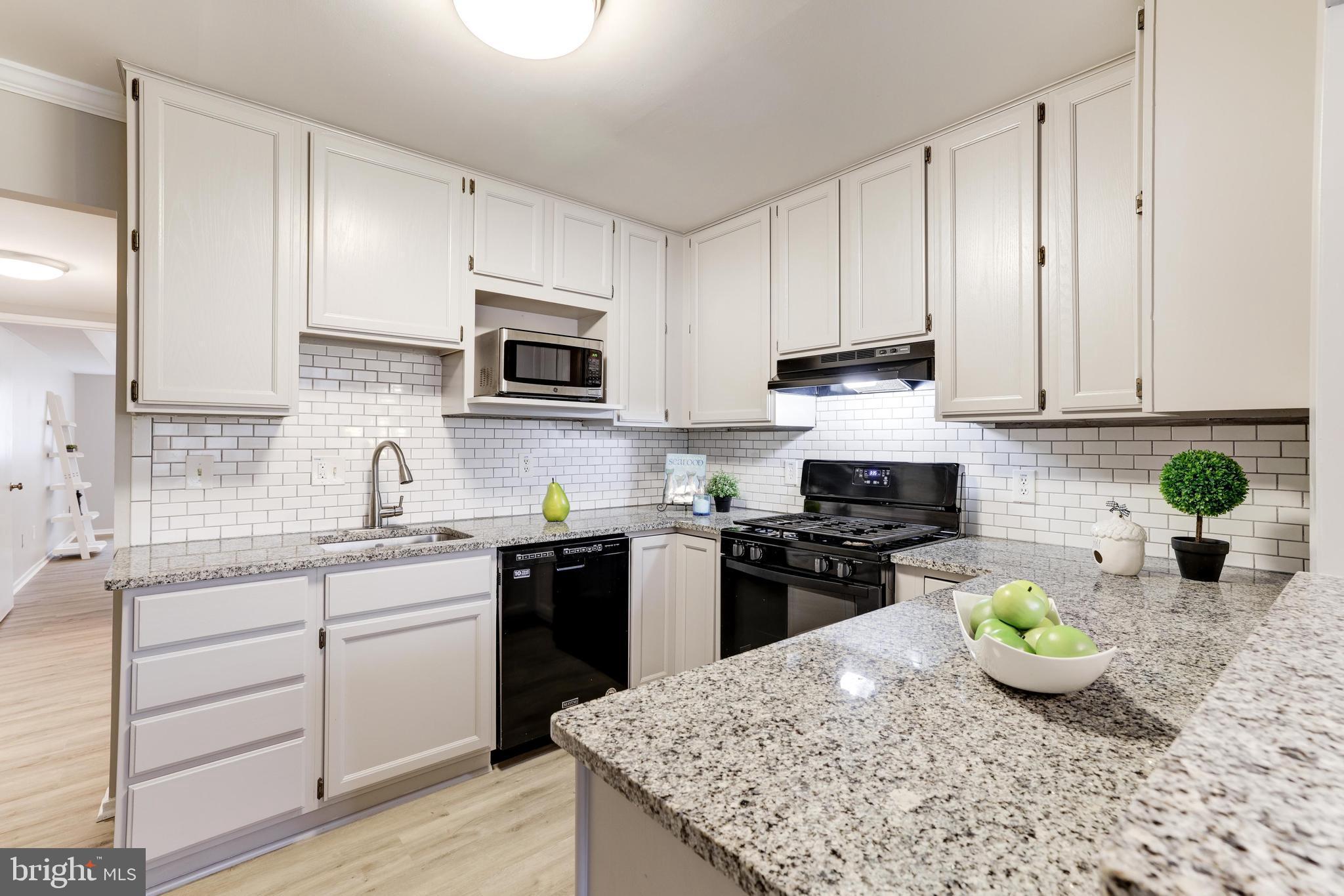 1668 Parkcrest Circle, Unit 100 Reston, VA 20190 - Photo 13 of 22 Gas stove with new range hood.