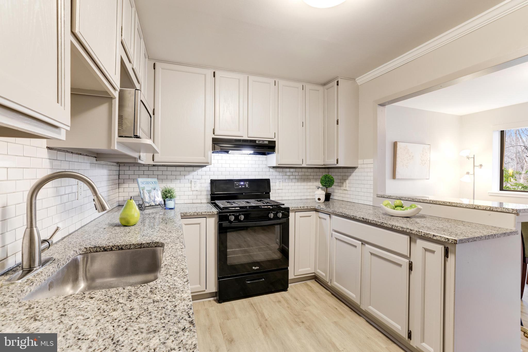 1668 Parkcrest Circle, Unit 100 Reston, VA 20190 - Photo 16 of 22 Kitchen was renovated in 2016. Painted in 2023.