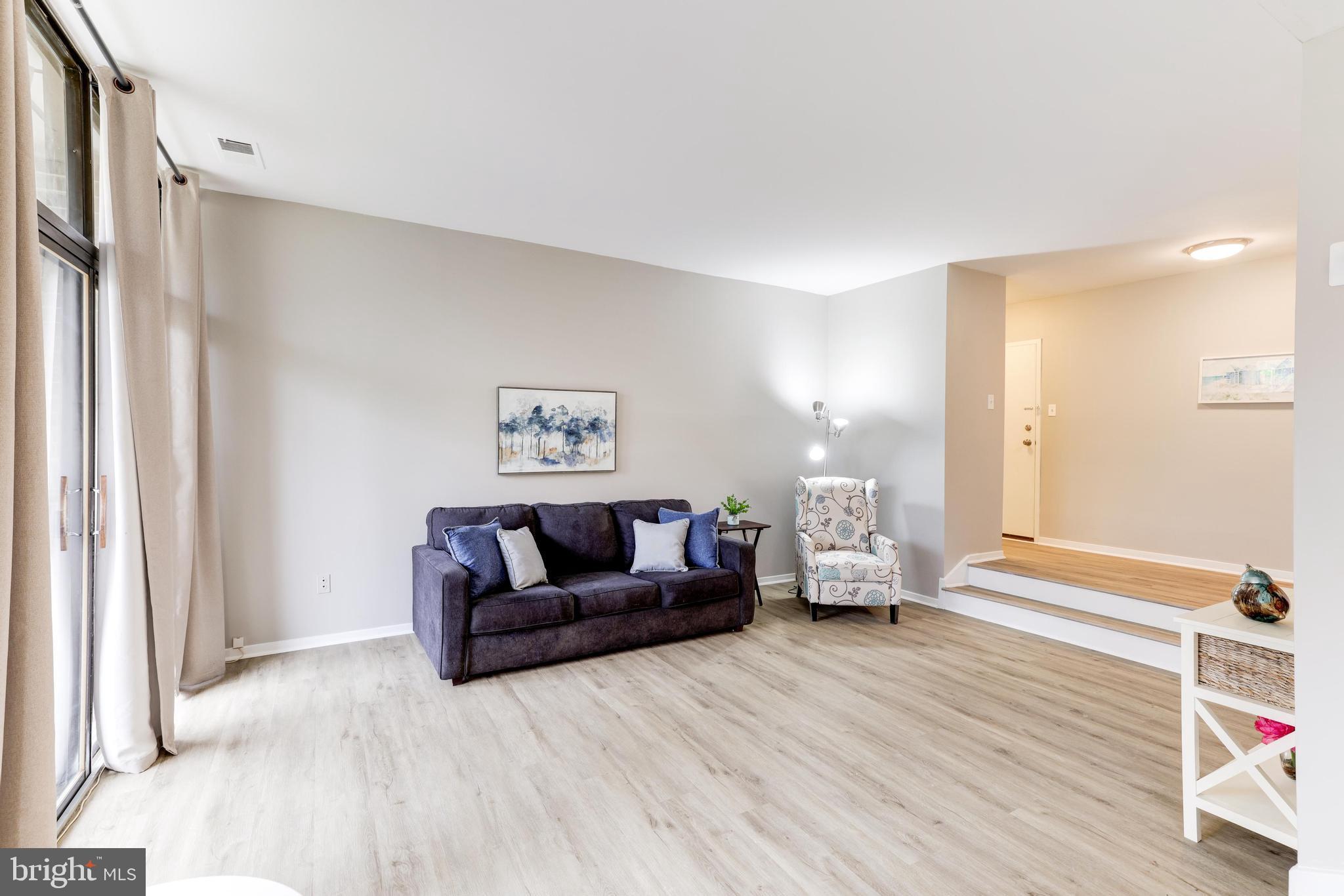 1668 Parkcrest Circle, Unit 100 Reston, VA 20190 - Photo 3 of 22 Large, light. and bright living room.