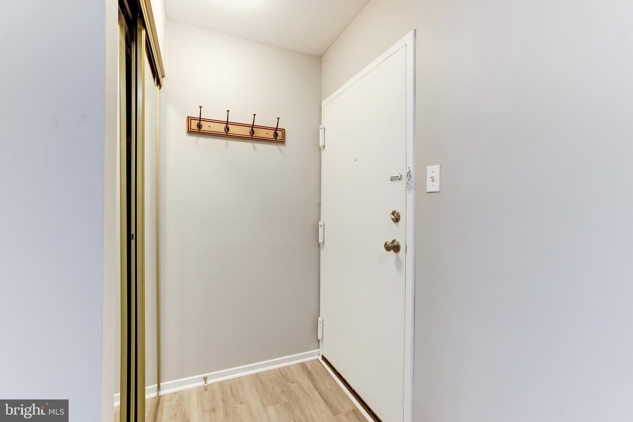 1668 Parkcrest Circle, Unit 100 Reston, VA 20190 - Photo 4 of 22 Welcoming foyer with large coat closet.