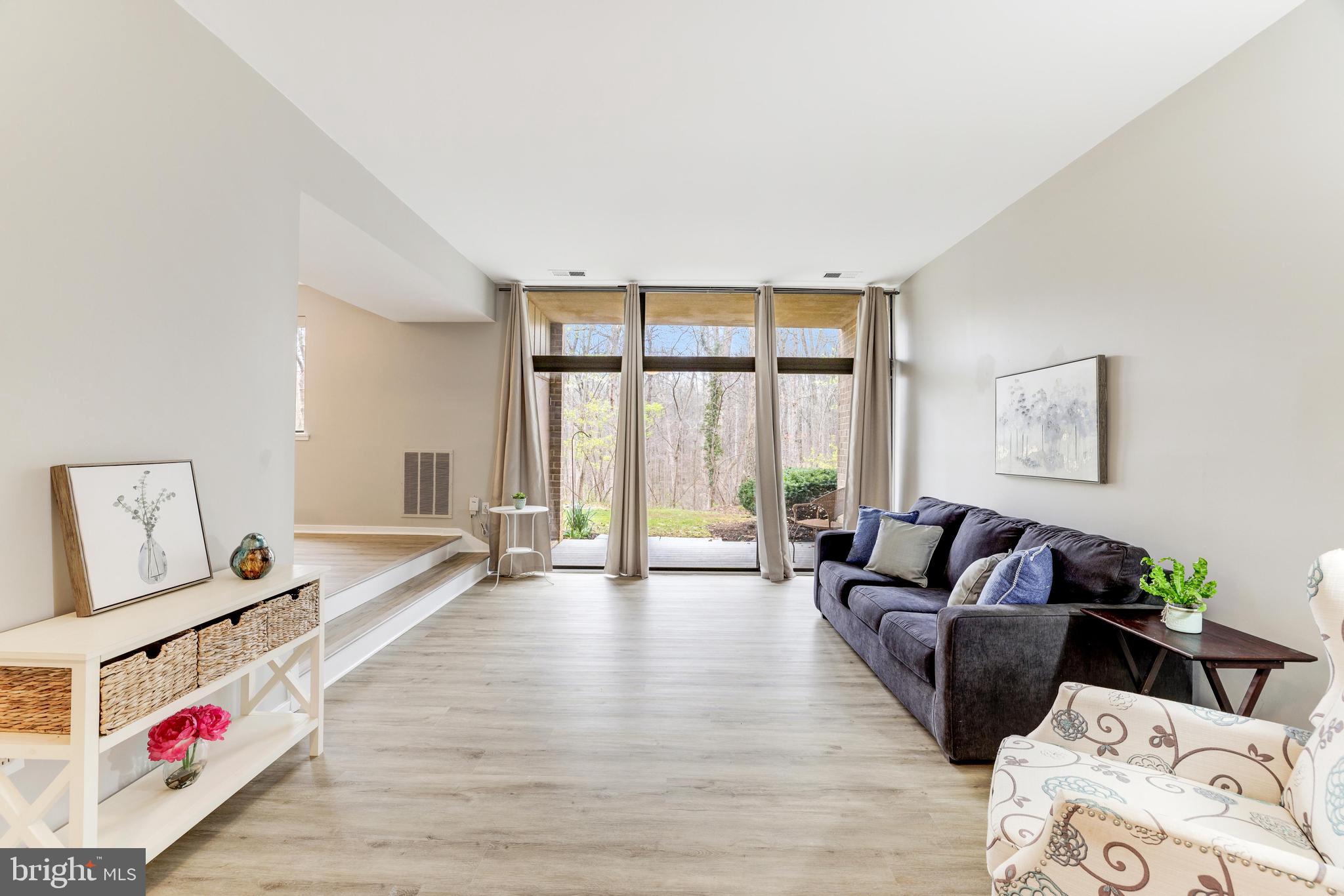 1668 Parkcrest Circle, Unit 100 Reston, VA 20190 - Photo 6 of 22 Wall of windows and transoms with gorgeous views.