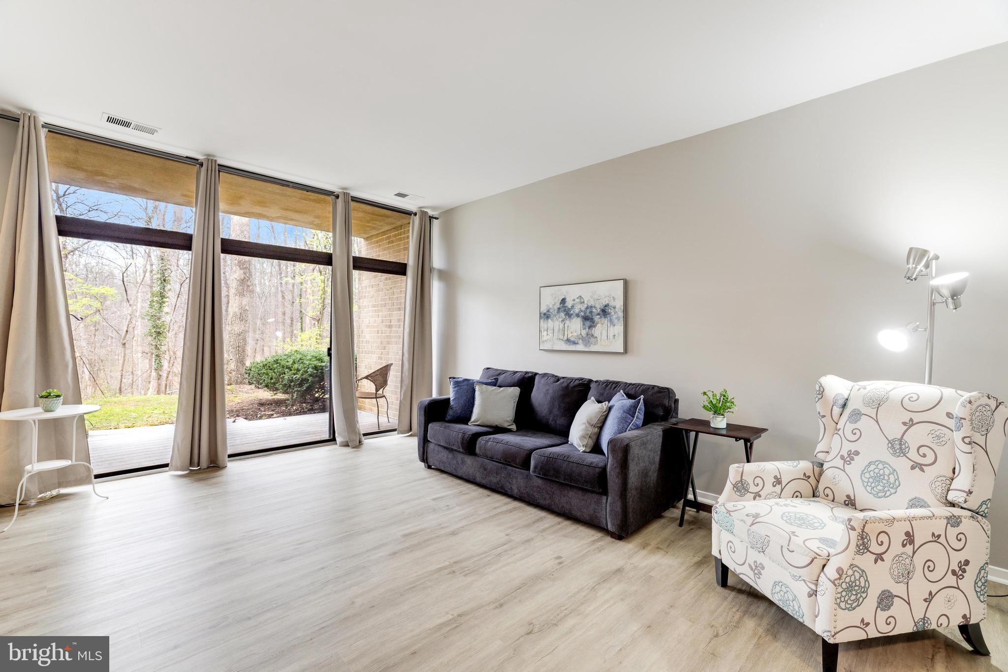 1668 Parkcrest Circle, Unit 100 Reston, VA 20190 - Photo 7 of 22 Living area opens to private patio.