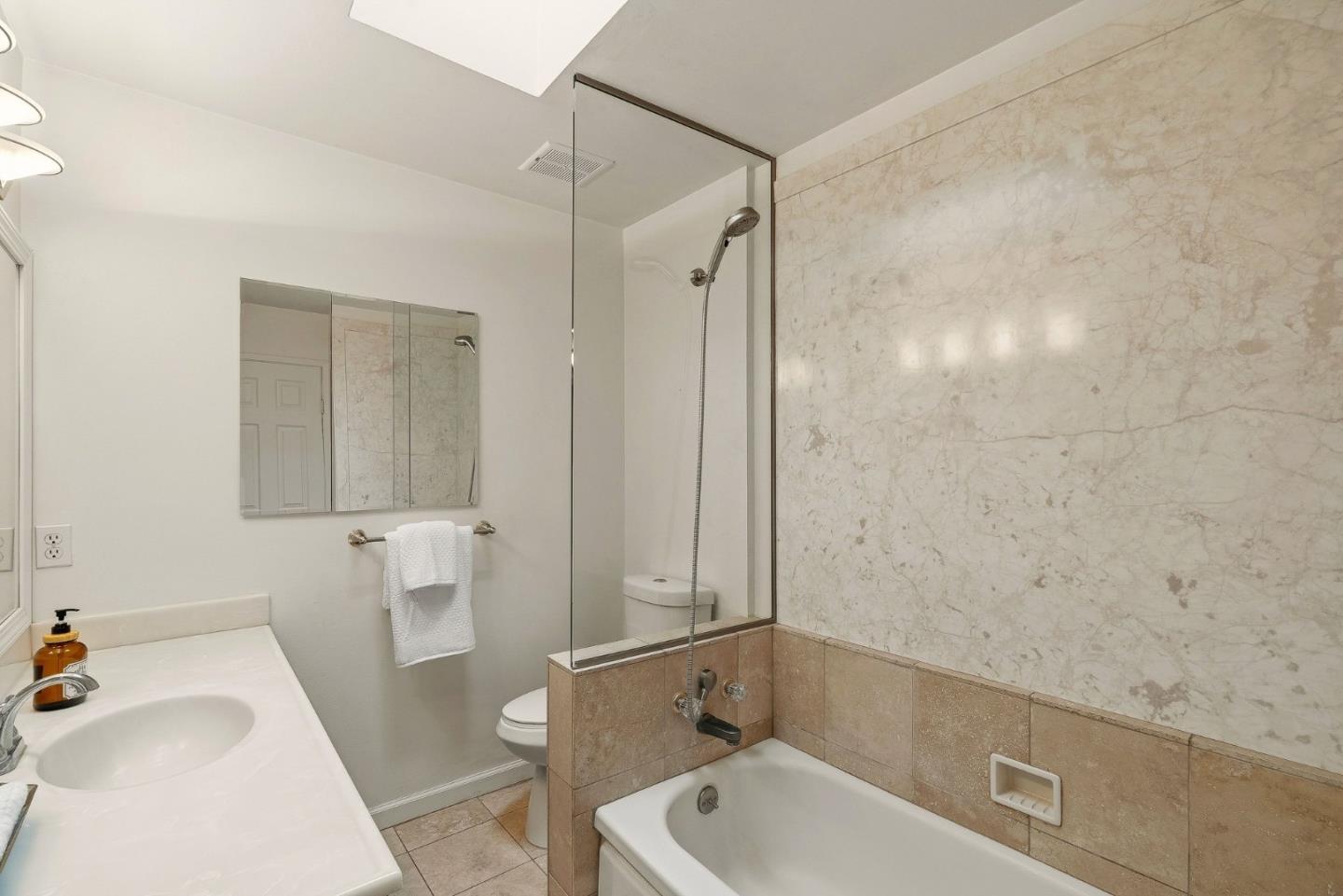 15 Del Rey Circle Salinas, CA 93901 - Photo 11 of 42 a bathroom with a tub a sink and a large mirror