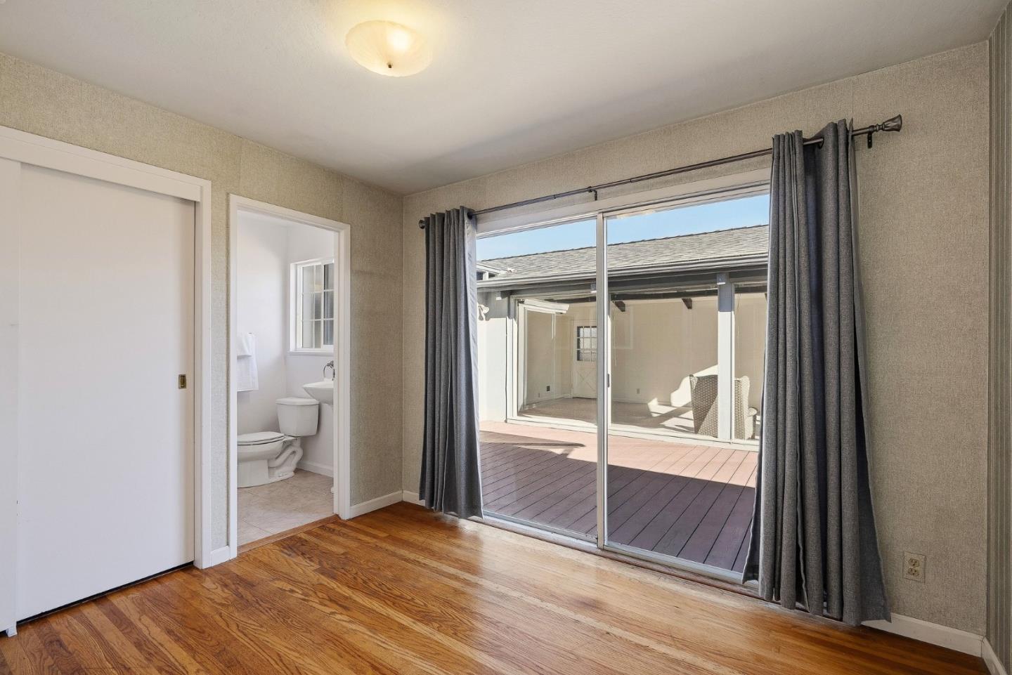 15 Del Rey Circle Salinas, CA 93901 - Photo 14 of 42 a bedroom with a bed and a glass door shower