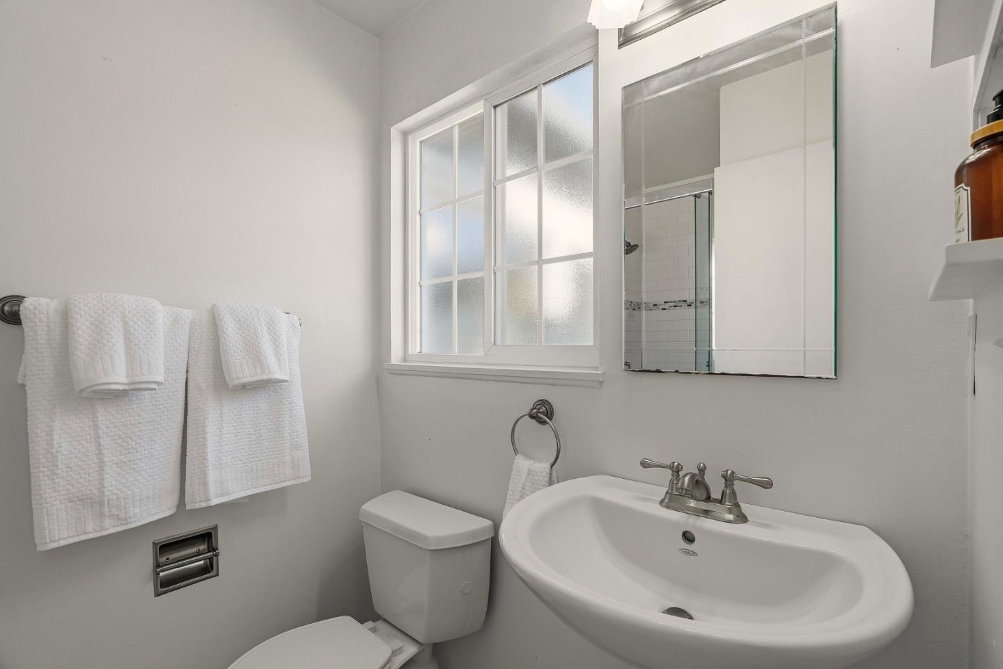 15 Del Rey Circle Salinas, CA 93901 - Photo 15 of 42 a bathroom with a sink mirror and toilet