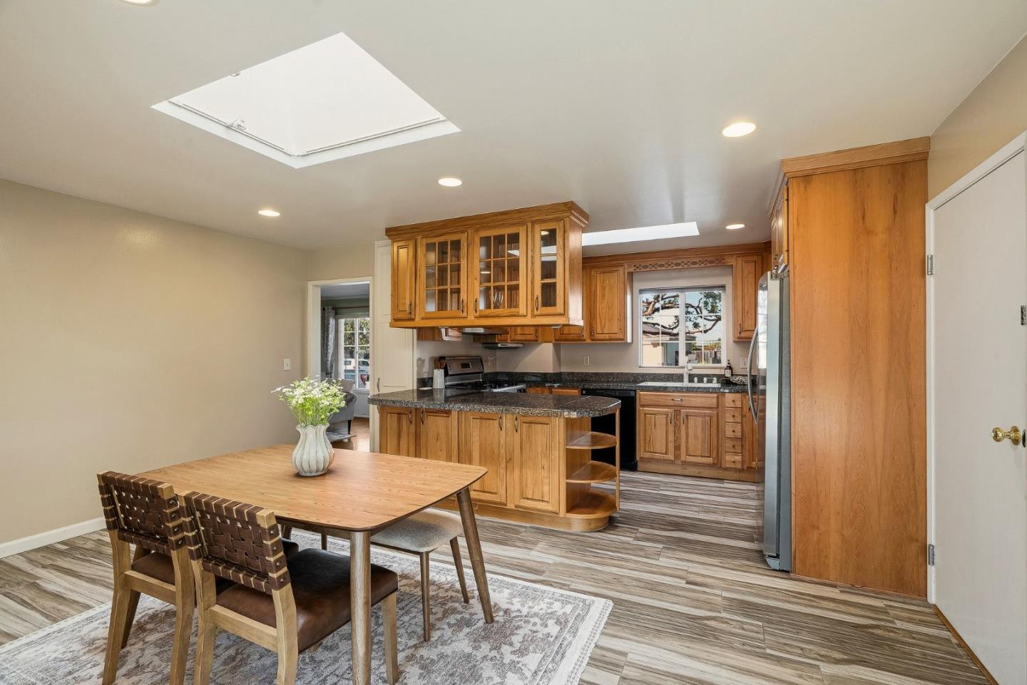 15 Del Rey Circle Salinas, CA 93901 - Photo 5 of 42 a kitchen with a table and chairs in it