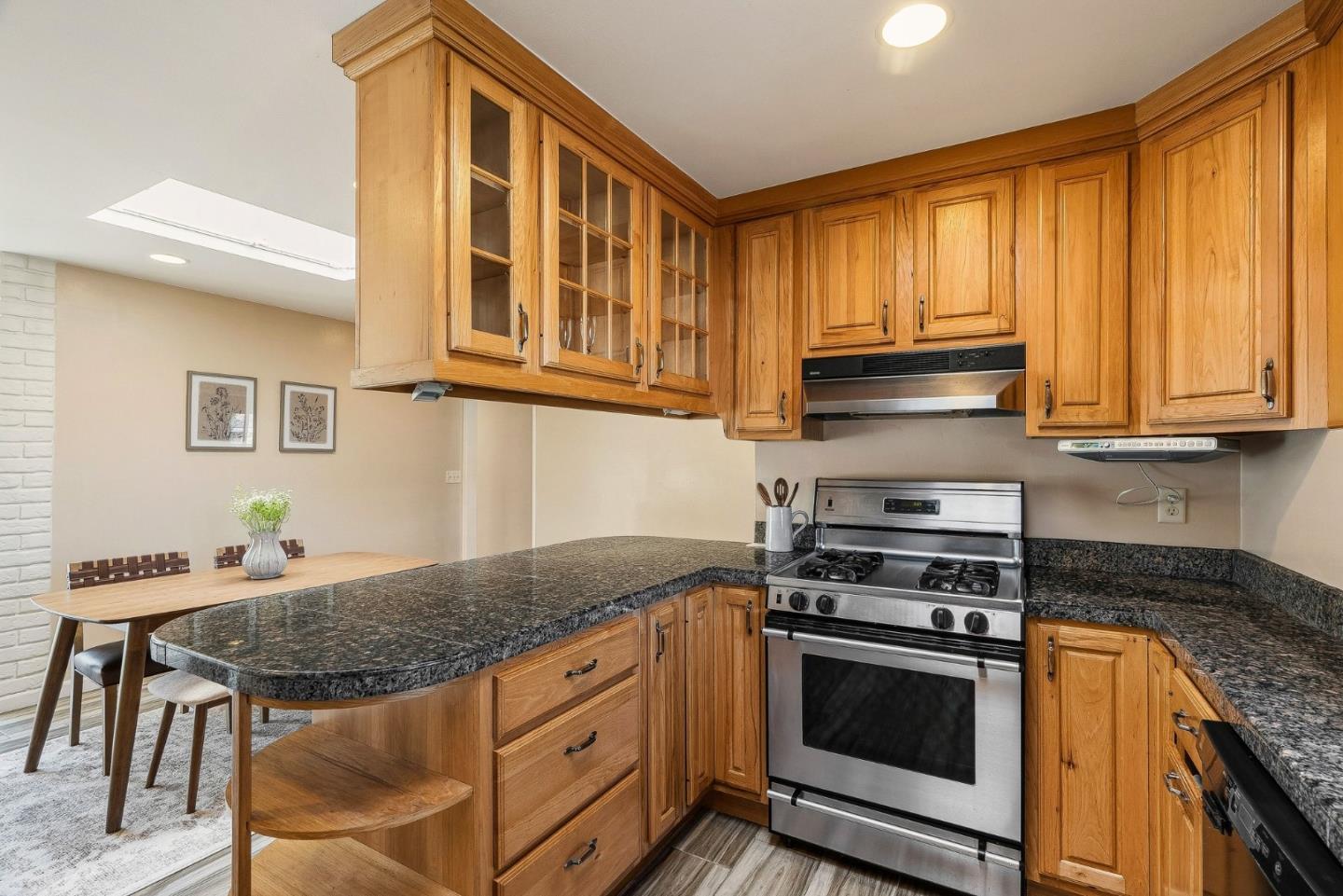 15 Del Rey Circle Salinas, CA 93901 - Photo 6 of 42 a kitchen with granite countertop wooden cabinets and stainless steel appliances