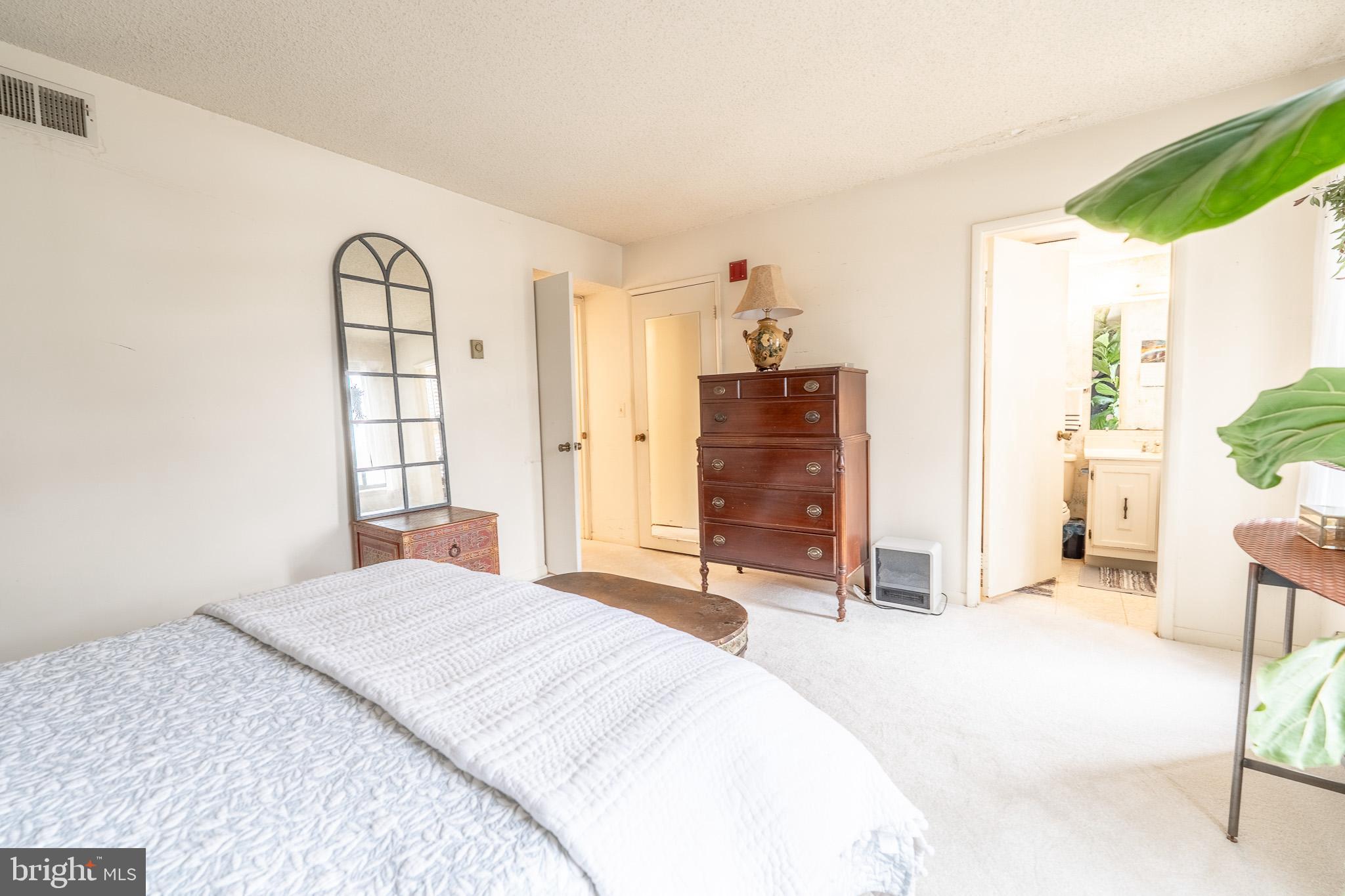 15300 Beaverbrook Court, Unit 882K Silver Spring, MD 20906 - Photo 15 of 21 Primary bedroom with ensuite bathroom