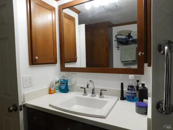 a bathroom with a sink and a mirror