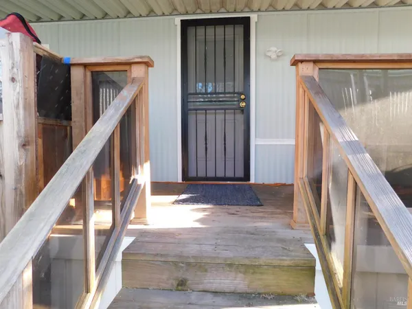 a view of front door of stairs