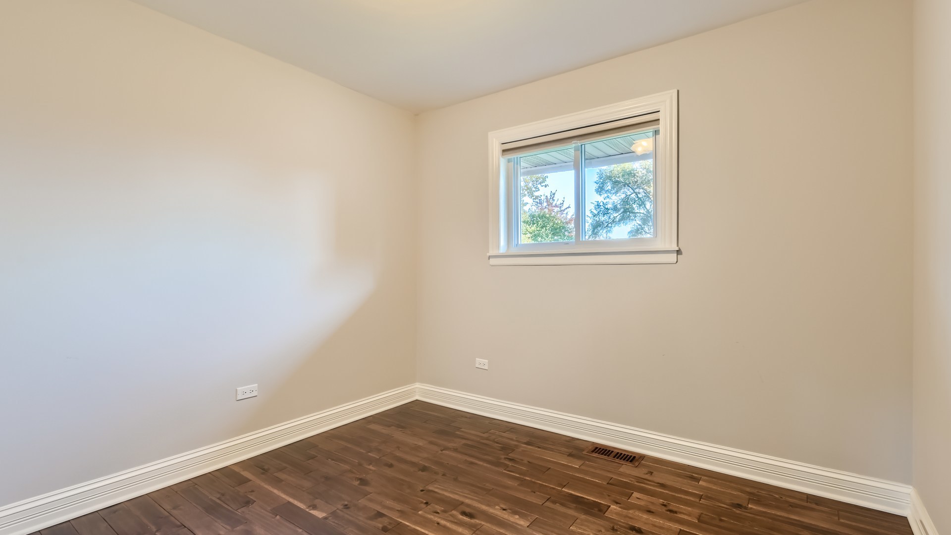 177 South Pinecrest Road Bolingbrook, IL 60440 - Photo 12 of 25 a view of an empty room with wooden floor and a window