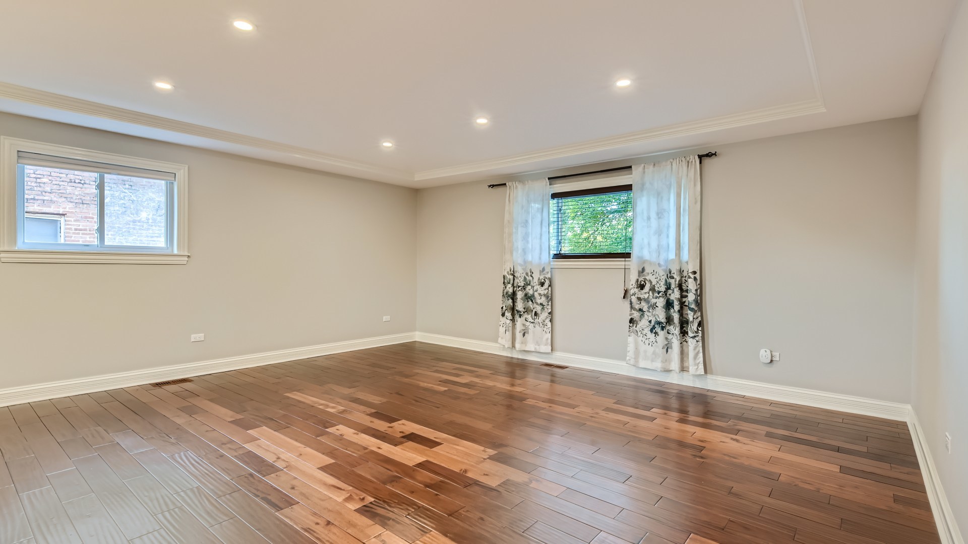 177 South Pinecrest Road Bolingbrook, IL 60440 - Photo 2 of 25 a view of an empty room with wooden floor and a window