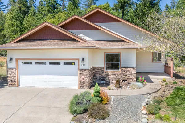 a front view of a house with garage