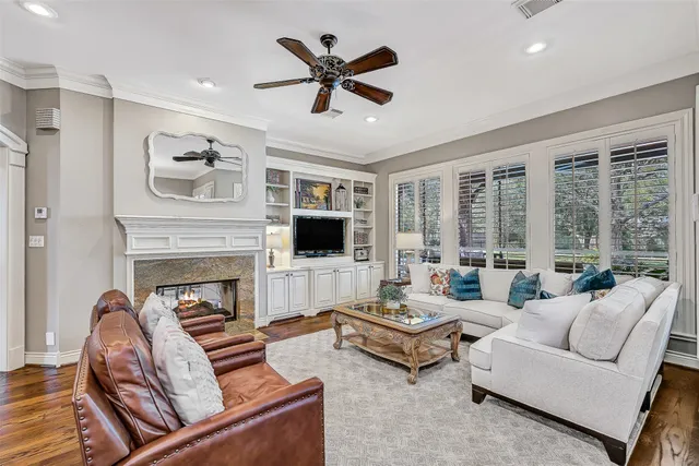 a living room with furniture fireplace and a flat screen tv