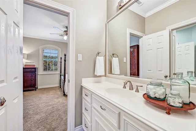 a bathroom with sink and mirror
