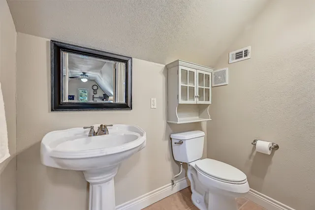 a view of a patio with a table chairs and a yard