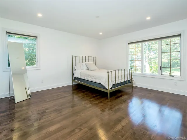 a room with a bed and window