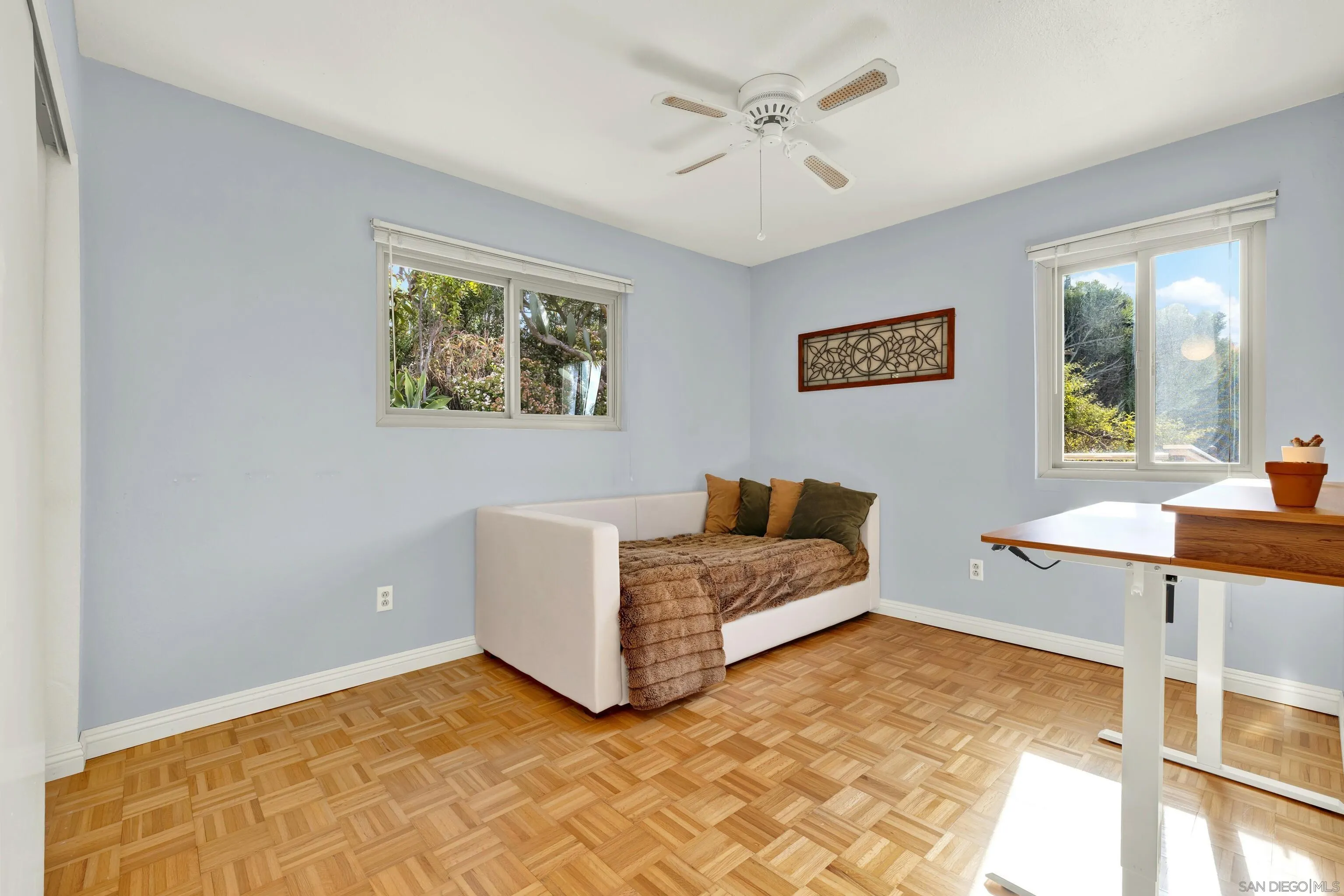 14827 High Valley Road Poway, CA 92064 - Photo 54 of 75 a spacious bedroom with a bed and a table in it